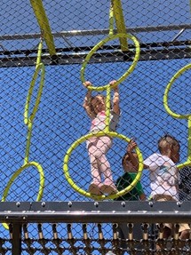 Children Enjoying the Outdoors Playing Outside on Playground