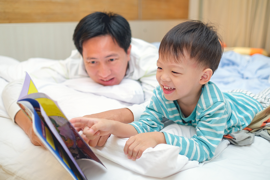 Father reading to child to support healthy brain development