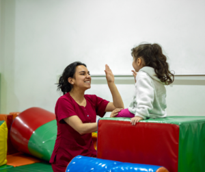 Occupational Therapist performing Occupational Therapy with a Young Girl