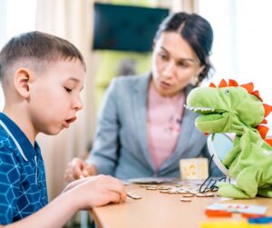 Child Working with Pediatric Speech-Language Pathologist at Brighton Center