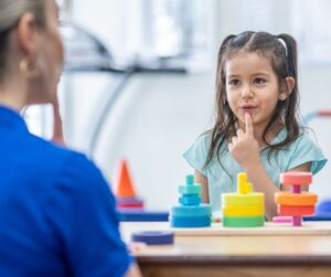 Girl working with Pediatric Speech-Language Pathologist at Brighton Center