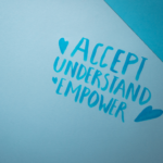 Small written text that says "Accept understand empower"