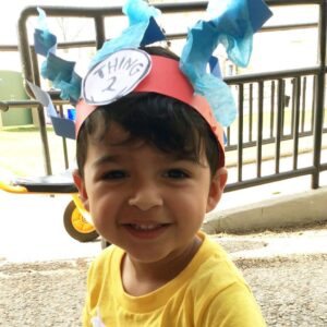 Child Smiling and Playing at Brighton Center 