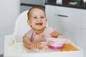 Child Playing with Food and Making a Mess